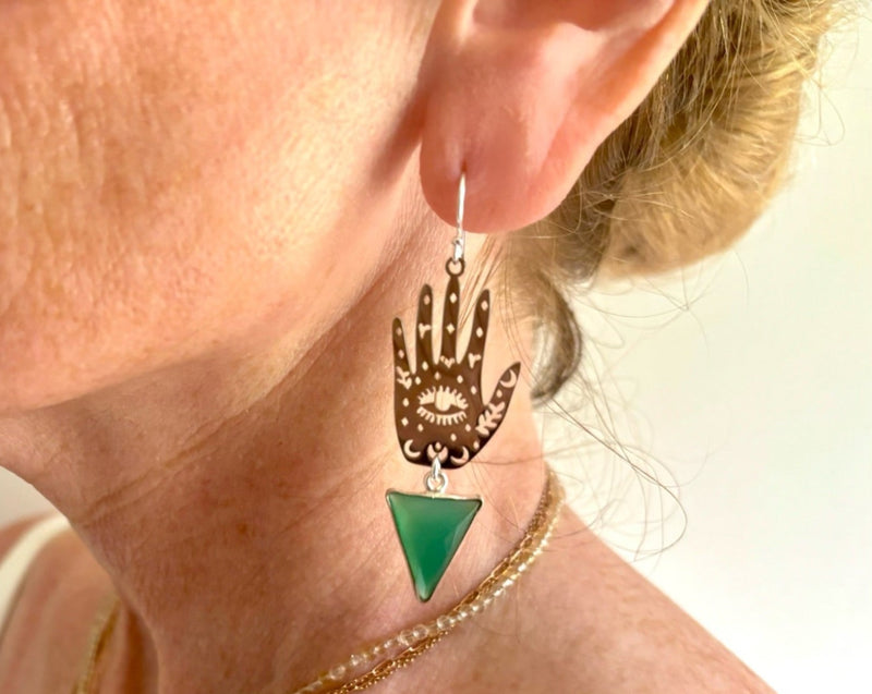 protective hand earring on model