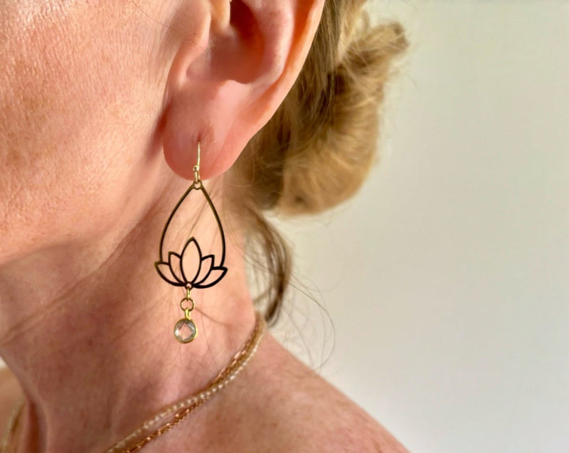 Lotus earring with quartz on model.