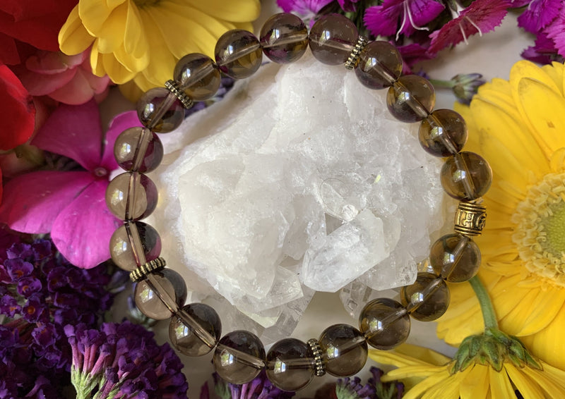 brown smokey quartz beads on white quartz cluster 