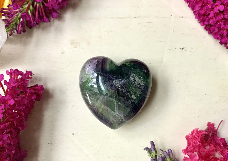 one rainbow fluorite heart with green, purple, black ad grey colors inside