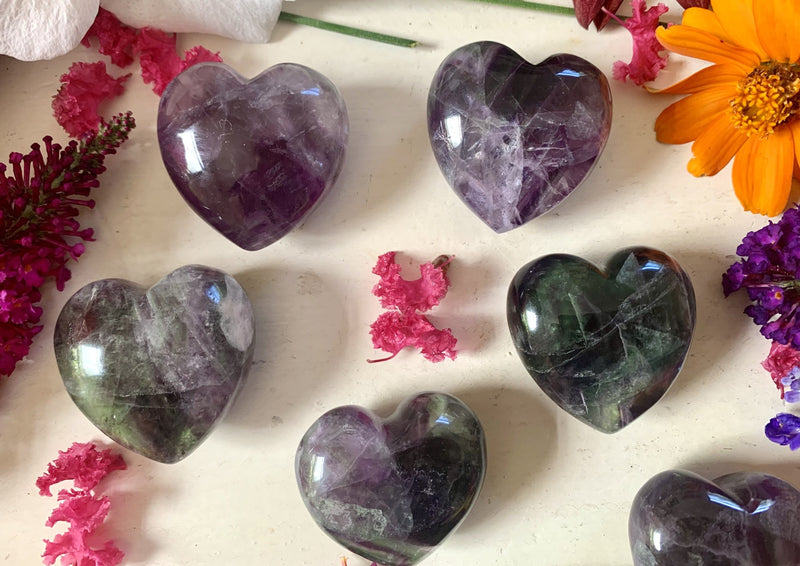 rainbow fluorite small hearts with green black and purple colors about 2 inches big.