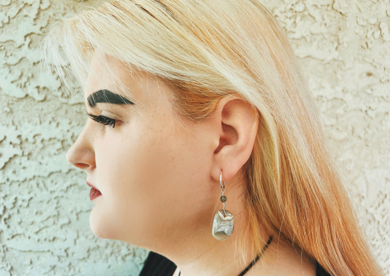 crazy lace agate earrings hanging from model.