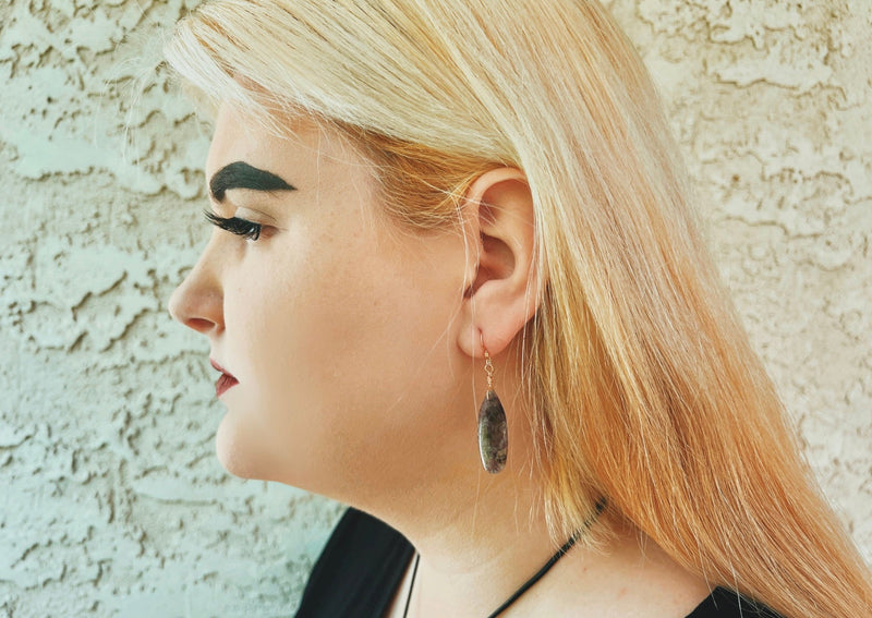 Chevron Amethyst teardrop earrings in 14KGF on model. 