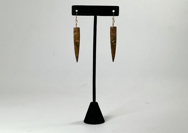 Red Creek Jasper Dagger earrings on black t stand. 
