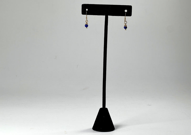 lapis small drop earrings hanging from a black t stand