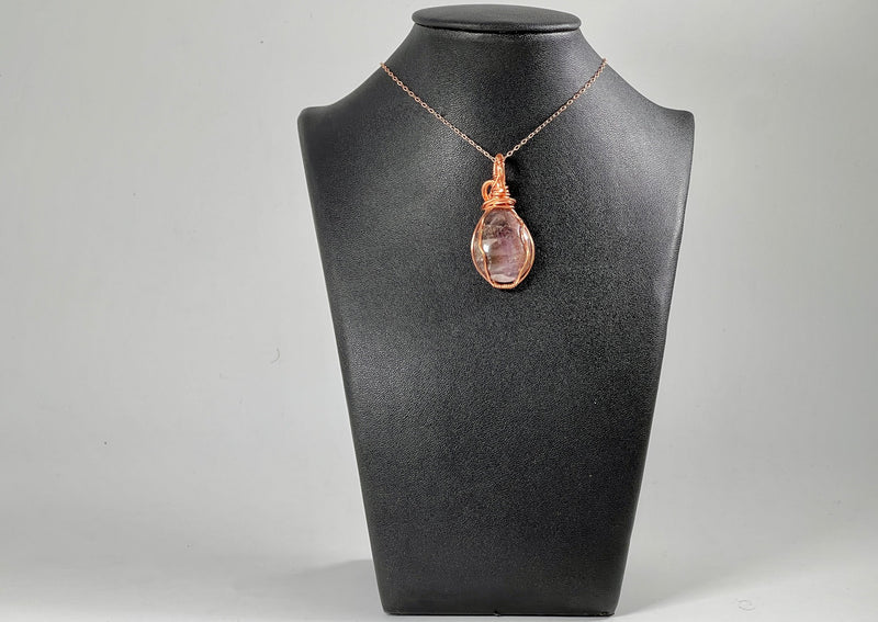 Super Seven Pendant wrapped in copper hanging on 14KGF Rose Chain