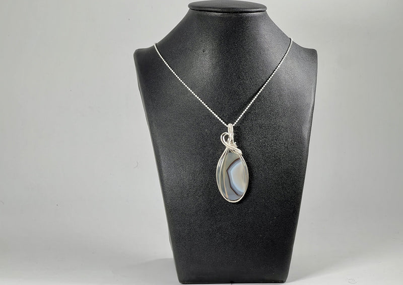 Agate pendant on sterling silver chain wrapped in sterling. 