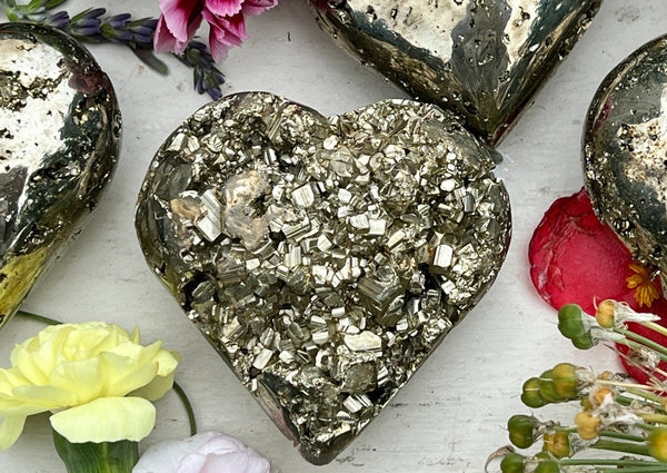 pyrite heart on white table. 