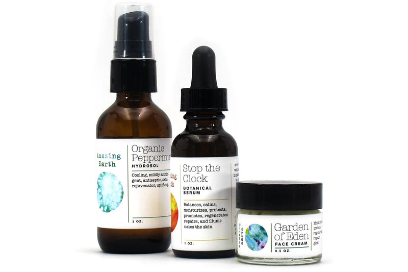 peppermint face system gift set with hydrosol, botanical serum, and face cream bottles